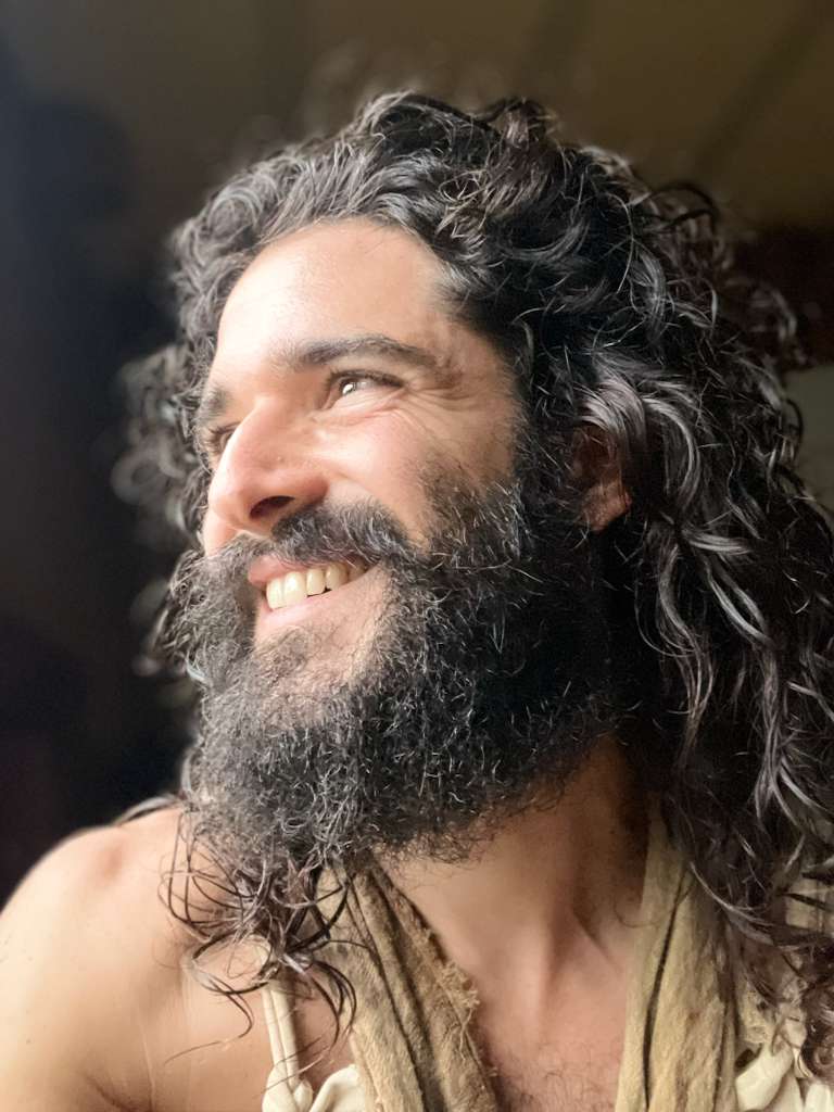 Portrait of Atabey, smiling, in warm light